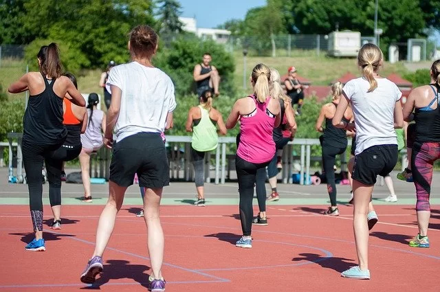 a group at a Zumba class getting the morning workout